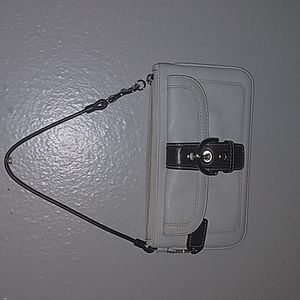 A leather white mini coach purse